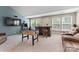 Finished basement with mounted TV, foosball table, and built in bar at 11523 Warfield Ave, Huntersville, NC 28078
