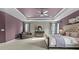 Spacious main bedroom with a tray ceiling, modern ceiling fan, and sitting area at 11523 Warfield Ave, Huntersville, NC 28078