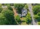 Stunning aerial view of a home surrounded by mature trees and green landscape at 127 Charlotte St, Mooresville, NC 28115