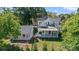 Aerial view of the home with a spacious yard, detached garage, and a covered porch at 127 Charlotte St, Mooresville, NC 28115