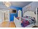 Stylish bedroom features vibrant blue walls, hardwood floors, and a decorative fireplace at 127 Charlotte St, Mooresville, NC 28115