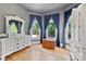 Bright bedroom offers generous natural light, hardwood floors, and ample space at 127 Charlotte St, Mooresville, NC 28115