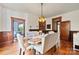 Inviting dining room features hardwood floors, decorative lighting, and elegant seating at 127 Charlotte St, Mooresville, NC 28115