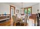 Cozy dining room displays classic wood trim, wainscoting, and hardwood floors at 127 Charlotte St, Mooresville, NC 28115