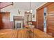 Gracious foyer featuring hardwood floors, a decorative fireplace, and intricate wood trim at 127 Charlotte St, Mooresville, NC 28115