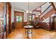 Welcoming foyer features wood accents, hardwood floors, and a grand staircase, exuding classic charm at 127 Charlotte St, Mooresville, NC 28115
