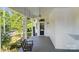 Charming front porch with a swing, creating a welcoming entrance to the home at 127 Charlotte St, Mooresville, NC 28115