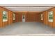 Spacious unfinished garage with ample room for parking and storage and two windows at 127 Charlotte St, Mooresville, NC 28115