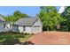 Detached garage with a neutral color palette and neatly landscaped yard at 127 Charlotte St, Mooresville, NC 28115