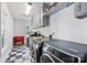 Laundry room with washer and dryer, checkerboard tile, and wood countertops at 127 Charlotte St, Mooresville, NC 28115