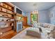Bright living room with hardwood floors, a cozy fireplace, and a stylish chandelier at 127 Charlotte St, Mooresville, NC 28115