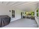 Inviting covered porch with seating area, perfect for enjoying the outdoors at 127 Charlotte St, Mooresville, NC 28115