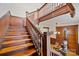 Elegant wooden staircase with detailed wood trim and a charming view of the home's interior at 127 Charlotte St, Mooresville, NC 28115