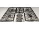 Stainless steel 5-burner gas cooktop with cast iron grates provides a sleek and functional cooking surface at 197 Tetcott St, Mooresville, NC 28115