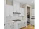 Stylish kitchen featuring stainless steel range hood and gas cooktop at 197 Tetcott St, Mooresville, NC 28115