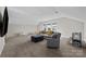 Carpeted bonus room featuring seating, natural light, and recreational space at 197 Tetcott St, Mooresville, NC 28115