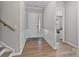Welcoming foyer with hardwood floors, wainscoting, and a view into the living room at 197 Tetcott St, Mooresville, NC 28115
