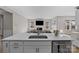 Modern kitchen island with sink and stainless steel dishwasher at 197 Tetcott St, Mooresville, NC 28115