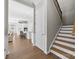 Bright entryway featuring hardwood floors, staircase, and an open view to the kitchen at 197 Tetcott St, Mooresville, NC 28115