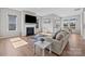 Light-filled living room boasts hardwood floors, a fireplace, and ample windows for natural light at 197 Tetcott St, Mooresville, NC 28115