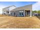 Fenced backyard with a covered porch, perfect for outdoor enjoyment and privacy at 197 Tetcott St, Mooresville, NC 28115