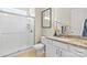 Bright bathroom with a tiled shower, granite countertops, and white cabinets at 197 Tetcott St, Mooresville, NC 28115
