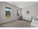 Cozy bedroom with two windows, gray carpet, and a white crib at 197 Tetcott St, Mooresville, NC 28115