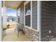 Welcoming front porch with cozy seating area and a view of the neighborhood at 197 Tetcott St, Mooresville, NC 28115