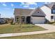 Charming single-story home with well-manicured lawn, two-car garage, and inviting front porch at 197 Tetcott St, Mooresville, NC 28115