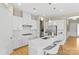 Beautiful white kitchen with stainless steel appliances, an island, and pendant lighting at 197 Tetcott St, Mooresville, NC 28115