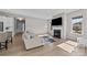 Cozy living room with a fireplace and large windows for natural light at 197 Tetcott St, Mooresville, NC 28115