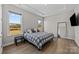 Spacious bedroom features tray ceilings, hardwood floors and large windows with backyard views at 197 Tetcott St, Mooresville, NC 28115