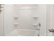 The bathroom includes a tub with white tile and shower niche at 2039 Morning Gold Dr, Maiden, NC 28650