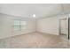 Bright bedroom with neutral carpet, a ceiling fan, a window, and an access panel in the ceiling at 2039 Morning Gold Dr, Maiden, NC 28650