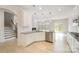 Open-concept kitchen featuring white cabinets, stainless steel appliances, granite countertops, and modern pendant lights at 2039 Morning Gold Dr, Maiden, NC 28650
