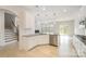 Open-concept kitchen featuring white cabinets, stainless steel appliances, granite countertops, and modern pendant lights at 2039 Morning Gold Dr, Maiden, NC 28650