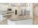 Modern kitchen with white cabinetry, stainless steel appliances, and a large center island with pendant lighting at 2039 Morning Gold Dr, Maiden, NC 28650