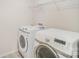 This laundry room has a washer, dryer and wire shelving at 2039 Morning Gold Dr, Maiden, NC 28650