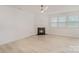 Bright living room featuring hardwood floors, a ceiling fan, and a fireplace at 2039 Morning Gold Dr, Maiden, NC 28650