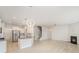 Open floor plan featuring a kitchen island, stairs, and fireplace at 2039 Morning Gold Dr, Maiden, NC 28650