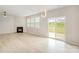 Bright living room with fireplace, hardwood floors, and sliding glass door to yard at 2039 Morning Gold Dr, Maiden, NC 28650