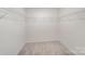 Spacious walk-in closet featuring wire shelving, carpeted floor, and a bright white interior at 2039 Morning Gold Dr, Maiden, NC 28650