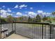 Balcony with a view of a parking lot and trees on a sunny day, offering outdoor space and fresh air at 211 Heritage Blvd # 301, Fort Mill, SC 29715