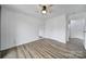 Bright bedroom with wood-look floors, a ceiling fan, double closets, and neutral walls at 211 Heritage Blvd # 301, Fort Mill, SC 29715