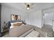 Staged bedroom with a bed, nightstands, rug, and white walls with wood-look floors at 211 Heritage Blvd # 301, Fort Mill, SC 29715