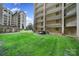 Exterior view of condo complex with balconies overlooking a courtyard and mature green trees at 211 Heritage Blvd # 301, Fort Mill, SC 29715