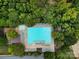 Aerial shot of a large swimming pool with ample lounge chairs, perfect for relaxation and summer fun at 211 Heritage Blvd # 301, Fort Mill, SC 29715