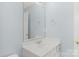Bathroom features a large mirror, white sink vanity, and neutral paint, creating a bright and functional space at 3109 Savannah Hills Dr, Matthews, NC 28105