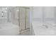 A well-lit bathroom showcasing a shower, tub, and vanity with neutral countertops at 3109 Savannah Hills Dr, Matthews, NC 28105