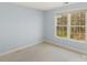Bedroom with neutral carpet and a large window providing plenty of natural light at 3109 Savannah Hills Dr, Matthews, NC 28105